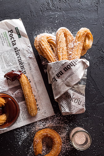 Traditional Spanish Churros with Chocolate and Powdered Sugar