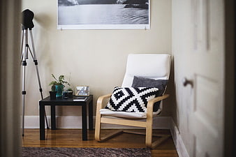 Modern Interior Corner with White Chair and Black Side Table