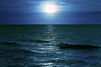 Moonlight Reflection on Dark Sea Horizon at Night