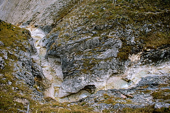 Alpine stream flowing through rocky limestone terrain