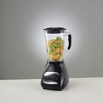 Black Blender with Fresh Kiwi and Pineapple Fruit