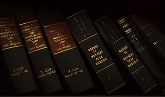 Dark Law Books on Shelf with Gold Lettering