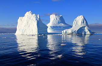 Majestic Icebergs Floating in Arctic Ocean Waters