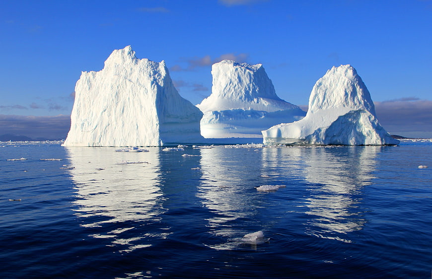 Majestic Icebergs Floating in Arctic Ocean Waters