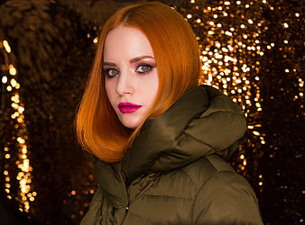 Portrait of Redhead Woman in Green Jacket with Bokeh Lights