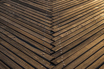 Close-up of wooden deck planks in herringbone pattern