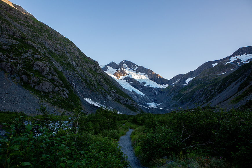 Hiking trail leading to a glacier in a mountain valley