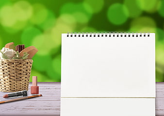 Blank Calendar Mockup With Beauty Tools And Green Bokeh Background