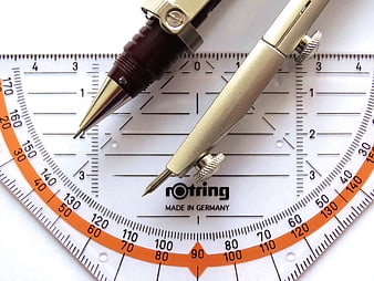 Drafting compass and protractor on white background
