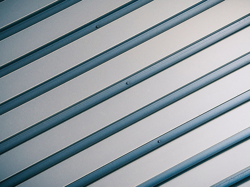 Abstract diagonal blue metal siding texture background