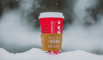 Red Starbucks Coffee Cup in Snowy Winter Landscape