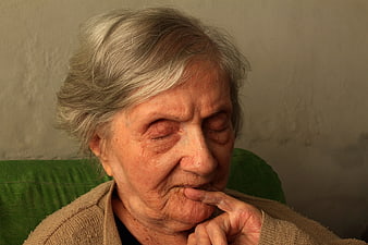 Portrait of elderly woman with eyes closed in contemplative pose