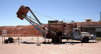 Vintage industrial truck with blower equipment in desert