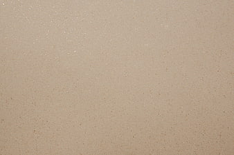 Beige Textured Paper Background With Subtle Glitter Particles