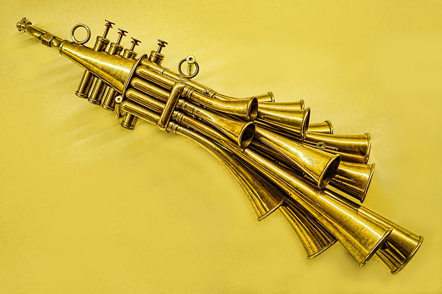 Vintage Brass Musical Instrument on Yellow Background