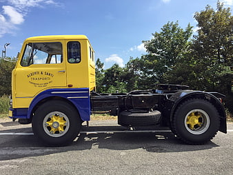 Side Profile Of Restored Vintage Yellow And Blue Fiat 682T3 Truck Chassis