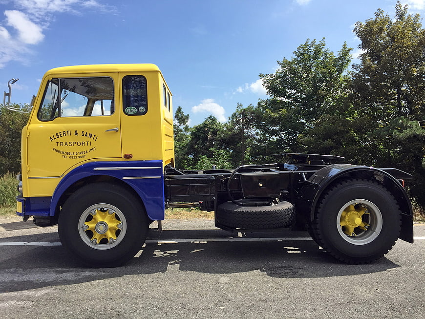 Side Profile Of Restored Vintage Yellow And Blue Fiat 682T3 Truck Chassis