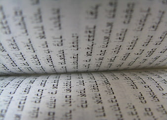 Close-up of Hebrew text on Torah scroll pages