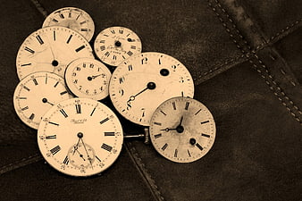 Vintage Antique Clock Faces on Leather Background