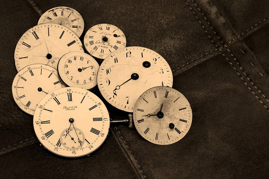 Vintage Antique Clock Faces on Leather Background