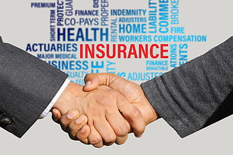 Business handshake with insurance word cloud background