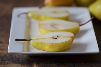 Sliced Yellow Pears on White Rectangular Plate