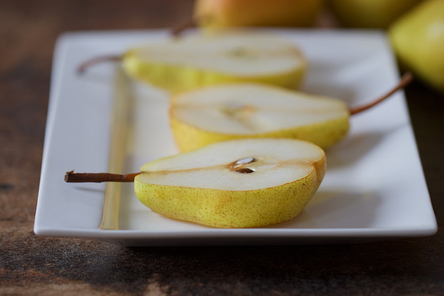 Sliced Yellow Pears on White Rectangular Plate