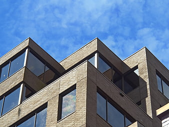 Modern Brick Office Building Exterior with Blue Sky
