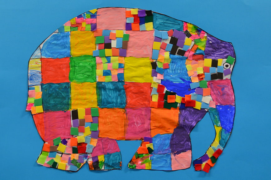 Colorful Paper Collage Elephant Craft on Blue Background