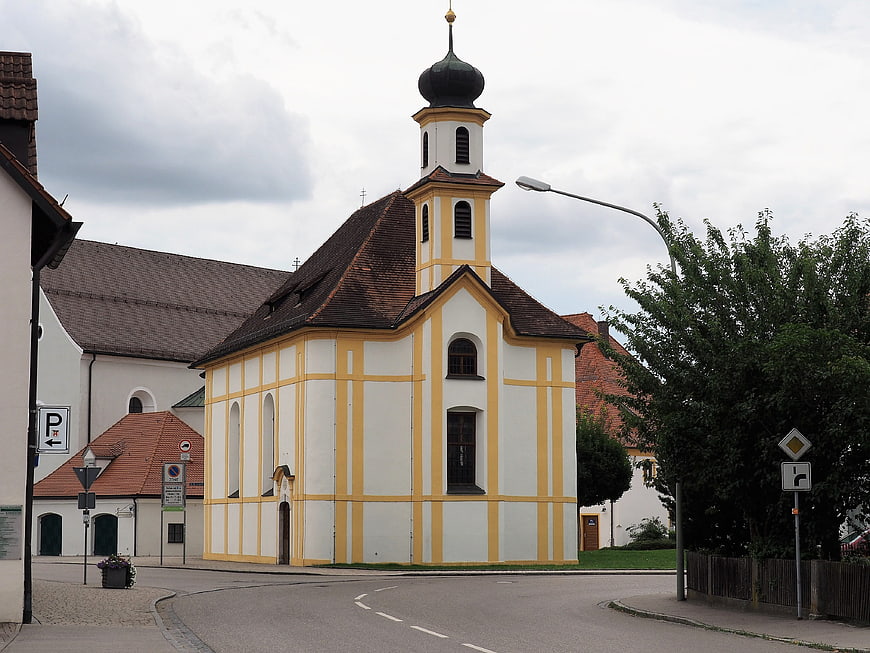 Yellow and white church with onion dome in German village