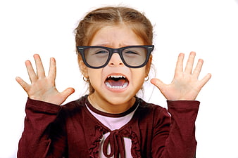 Cute little girl screaming with hands up wearing oversized glasses