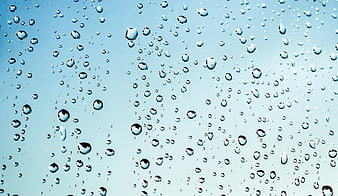 Water Droplets on Blue Glass Surface Background