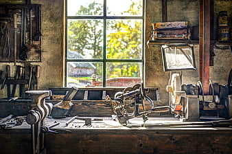 Vintage carpenter workshop with tools and window view