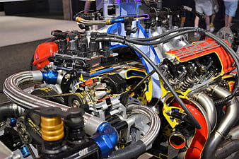 Close-up of a high-performance race car engine with red and blue components