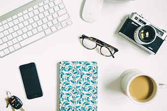 Flat Lay of Creative Workspace with Camera and Coffee