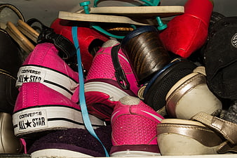 Pile of colorful children's shoes and sneakers in a box