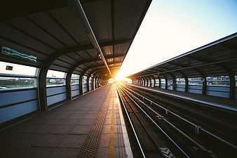 Empty Train Station Platform at Sunset with Golden Light