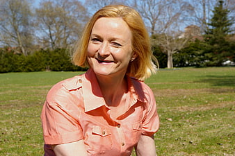 Smiling Middle-Aged Woman In Park