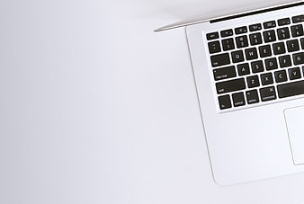 Minimalist Silver Laptop Keyboard on White Background