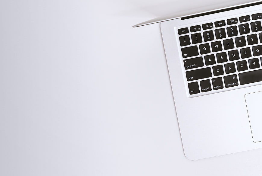 Minimalist Silver Laptop Keyboard on White Background