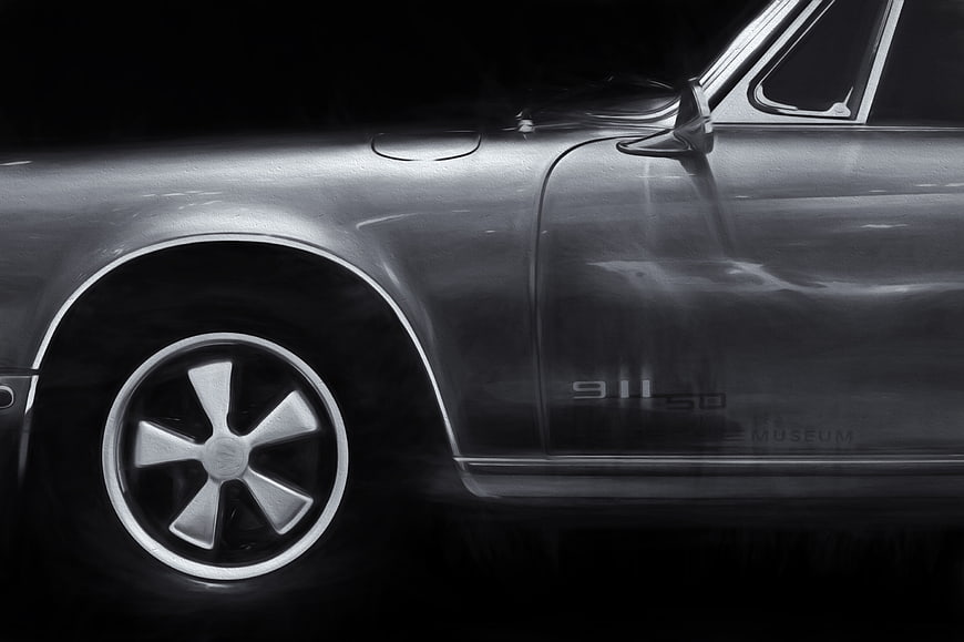 Close-up of vintage Porsche 911 SD side profile in black and white
