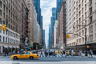 Busy New York City Street with Yellow Taxis and Pedestrians