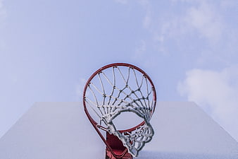 Low angle view of basketball hoop against blue sky