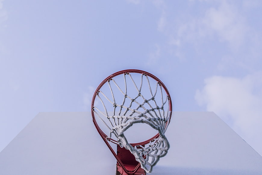 Low angle view of basketball hoop against blue sky