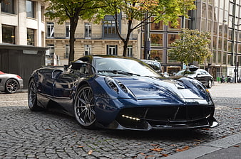 Blue Pagani Huayra Hypercar Parked on Cobblestone Street