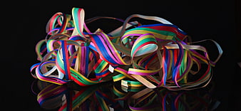 Multicolored Party Streamers on Black Background