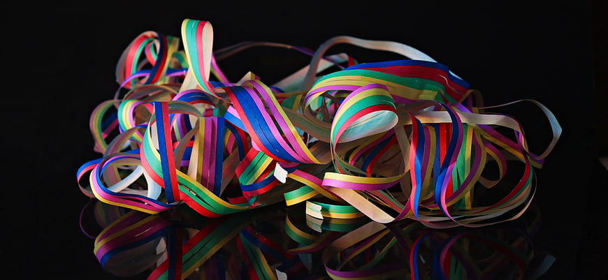 Multicolored Party Streamers on Black Background