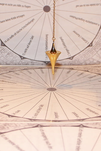 Gold Pendulum Over Esoteric Chart