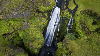 Aerial view of mossy waterfall in Iceland