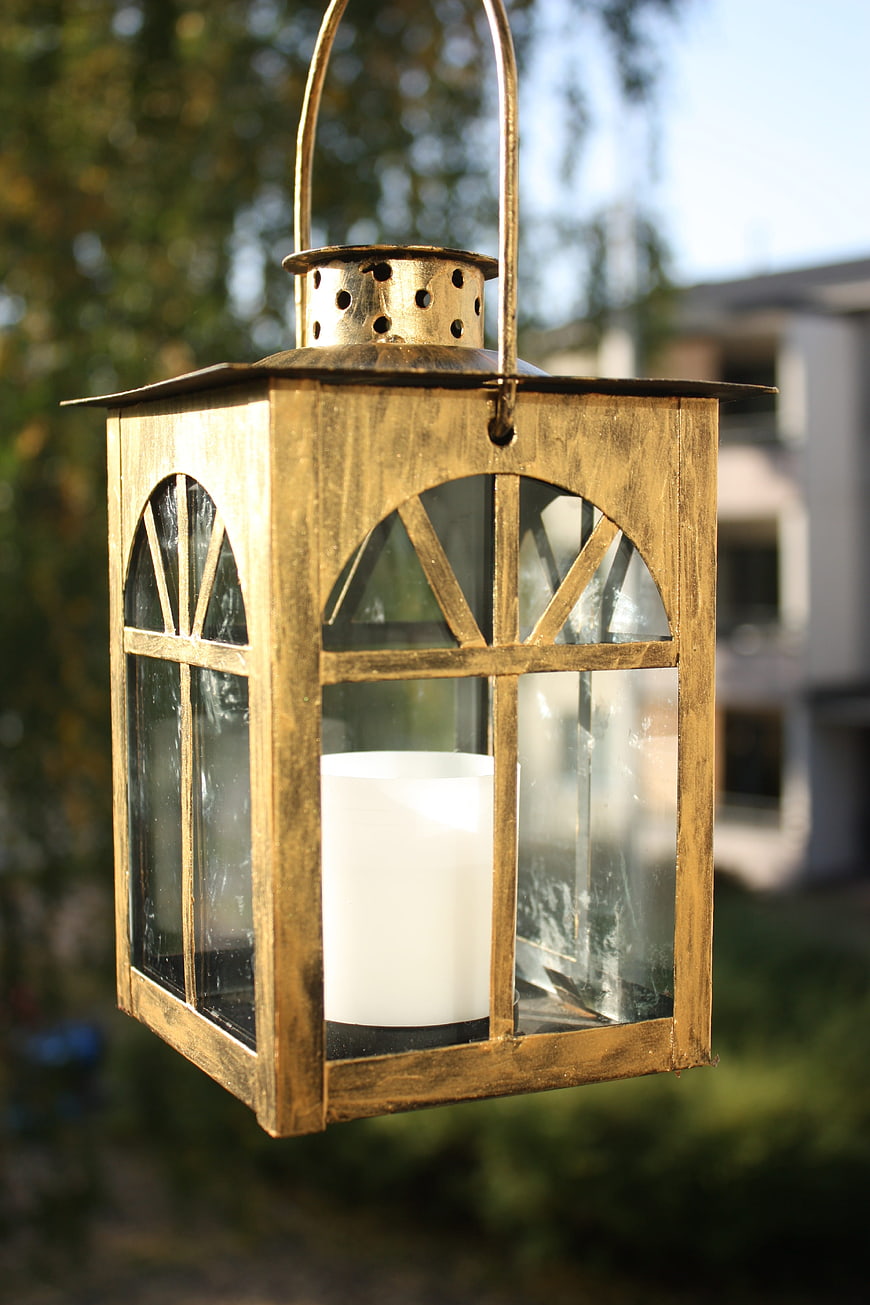Golden Hanging Lantern with Candle in Garden